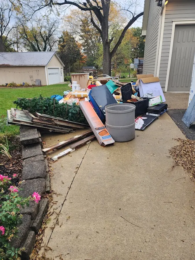 Dumpster being loaded with debris for 30 Yard Dumpster Rental in Smiths Station